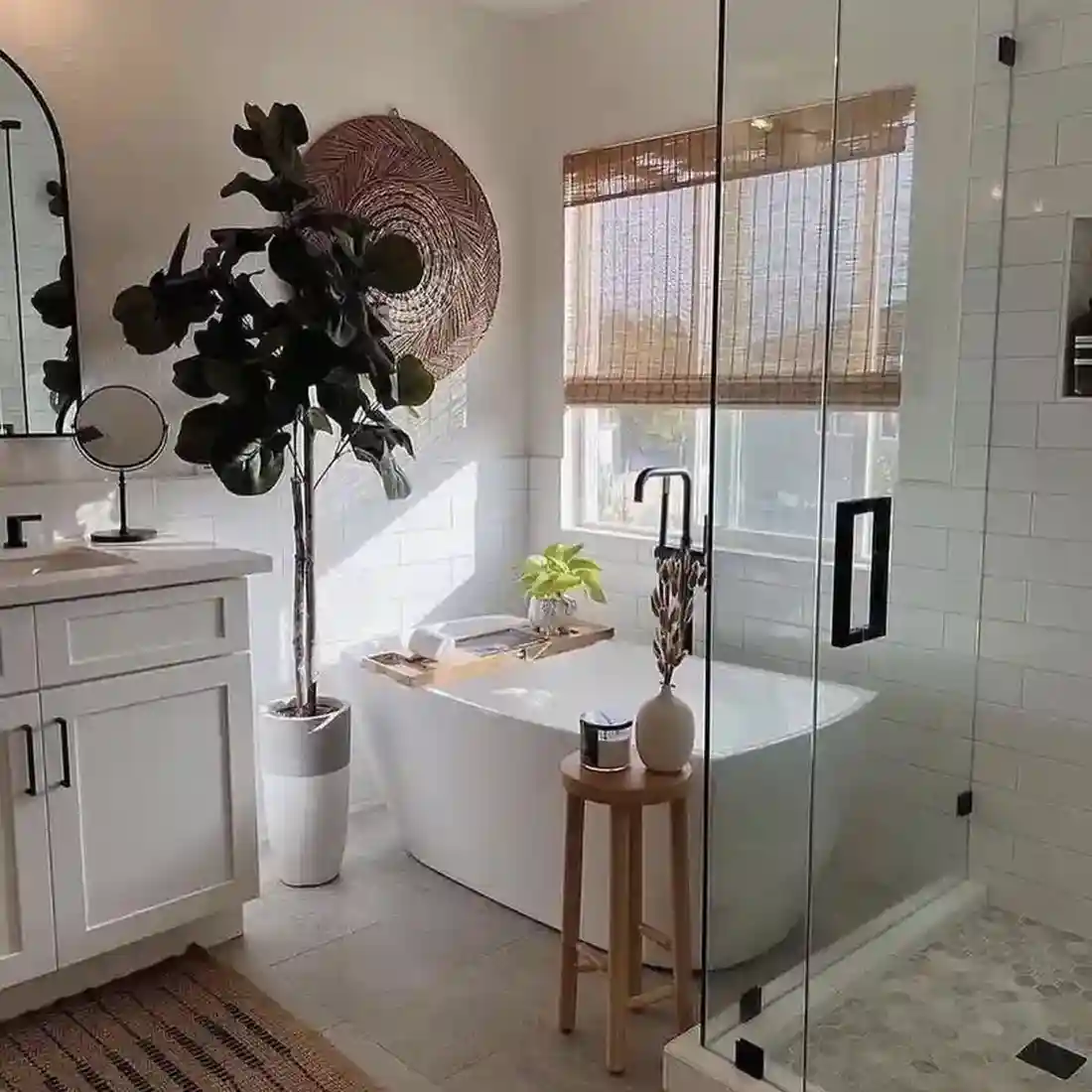 Modern farmhouse bathroom remodel with freestanding tub and glass shower