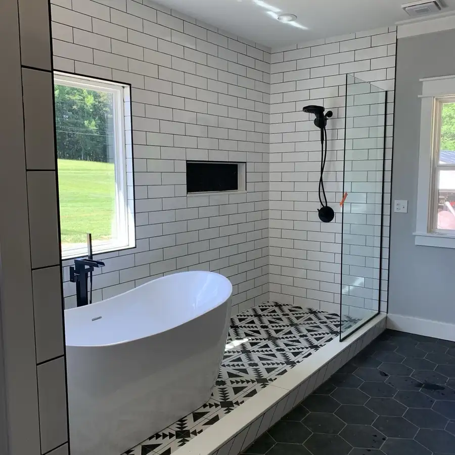 Bathroom renovation with subway tile and patterned floor